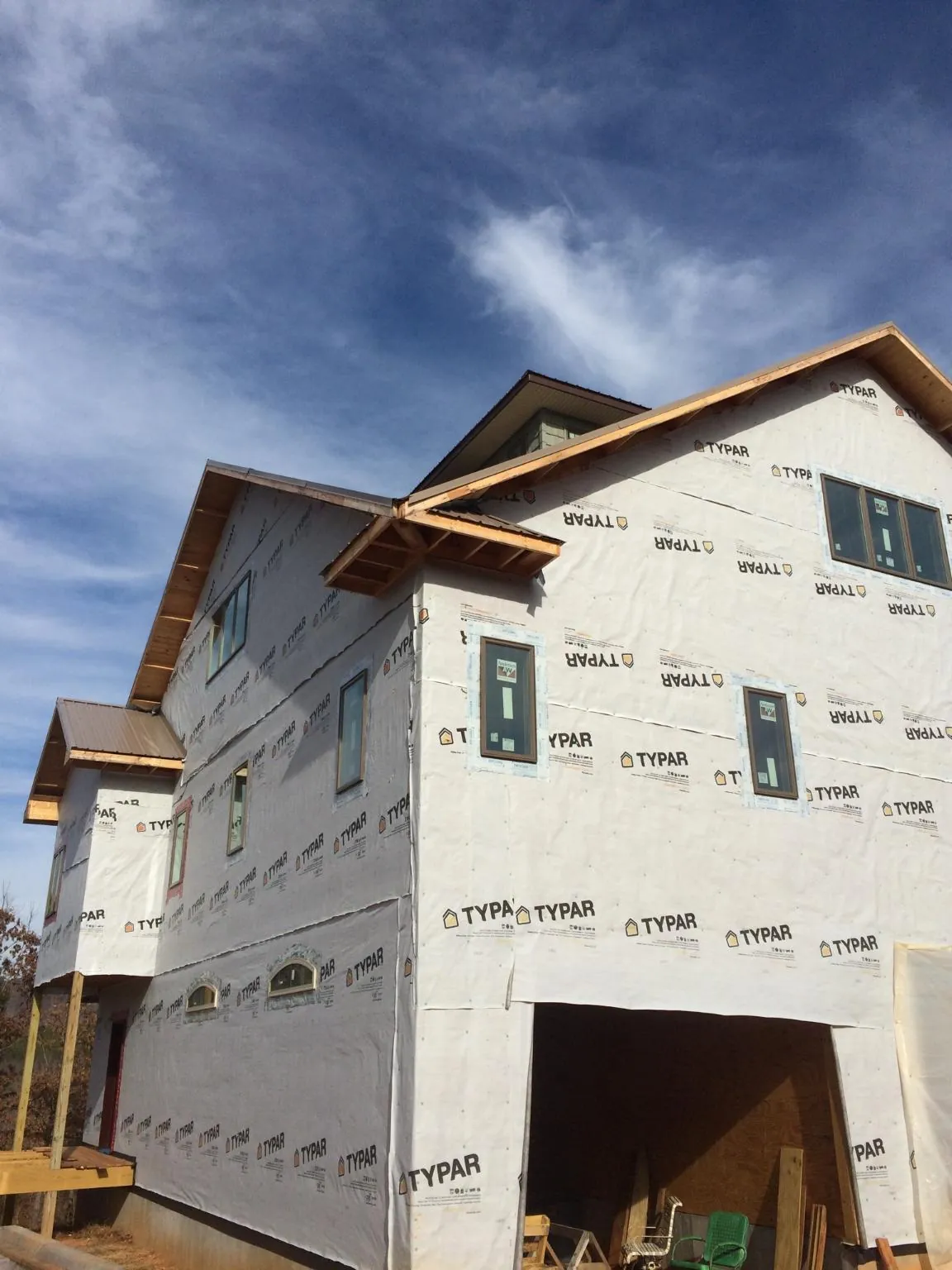 Stick built house wrapped in Typar with new roof framing and dormers in Whitehall